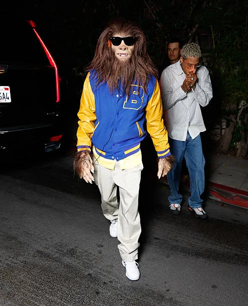 Tyga Rocks a Blue-and-Yellow Varsity Jacket with Vintage Flair